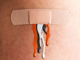 bandaid with brown orange and white bleeding out