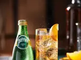 bottle of perrier and glass