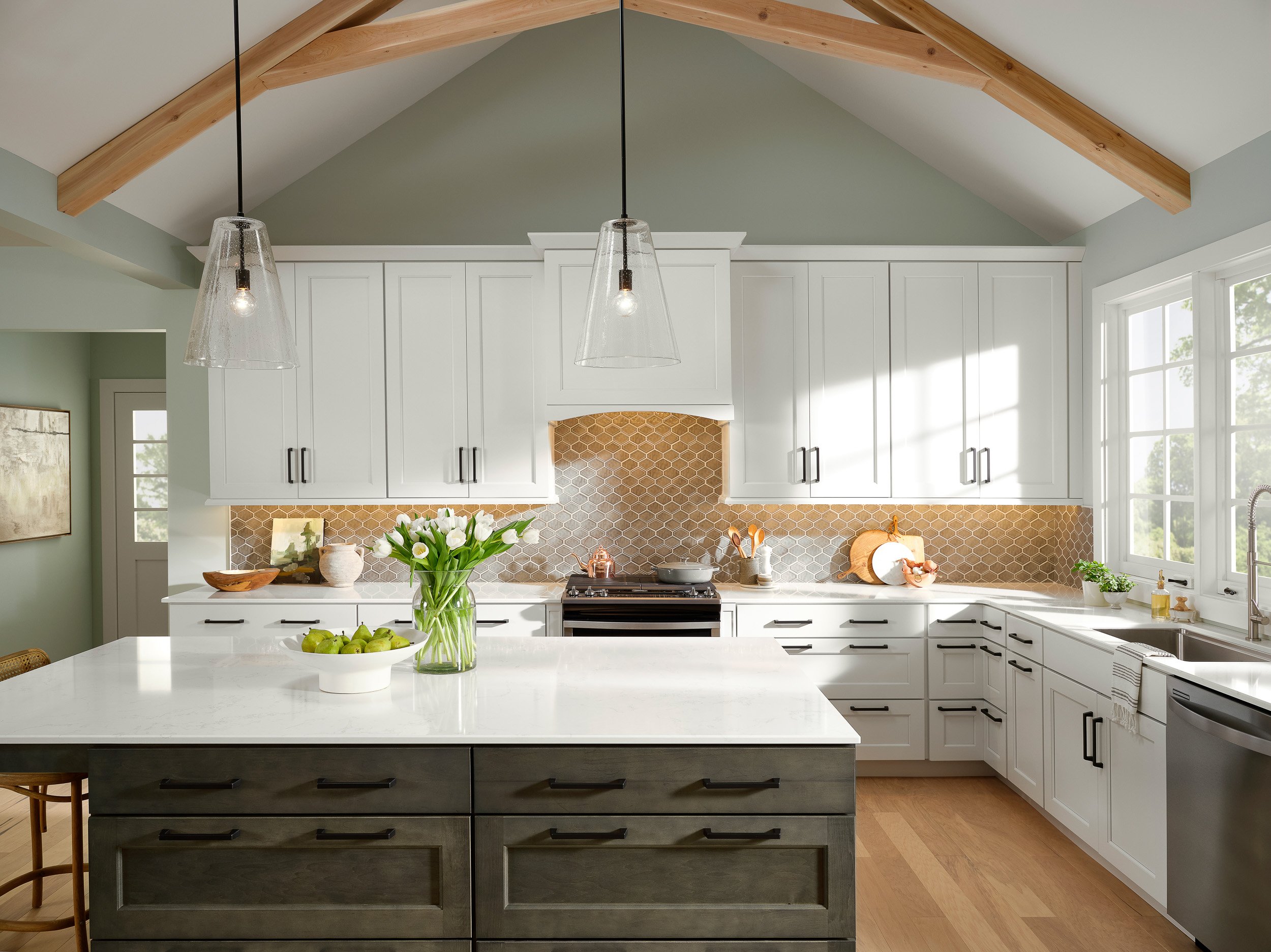 Large bright white kitchen with pendant lighting