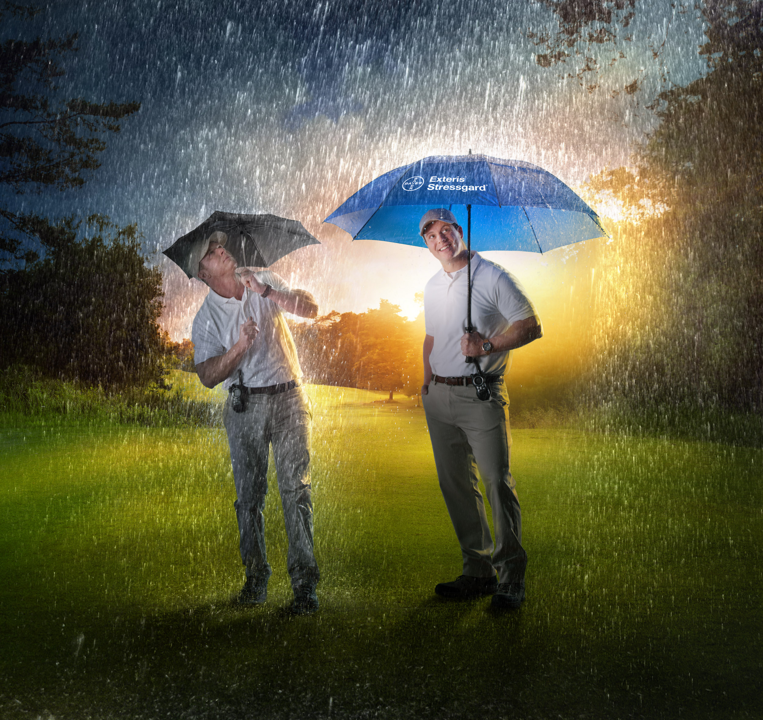 Two people in the rain with umbrellas 