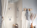 White and blue bathroom with feather vase
