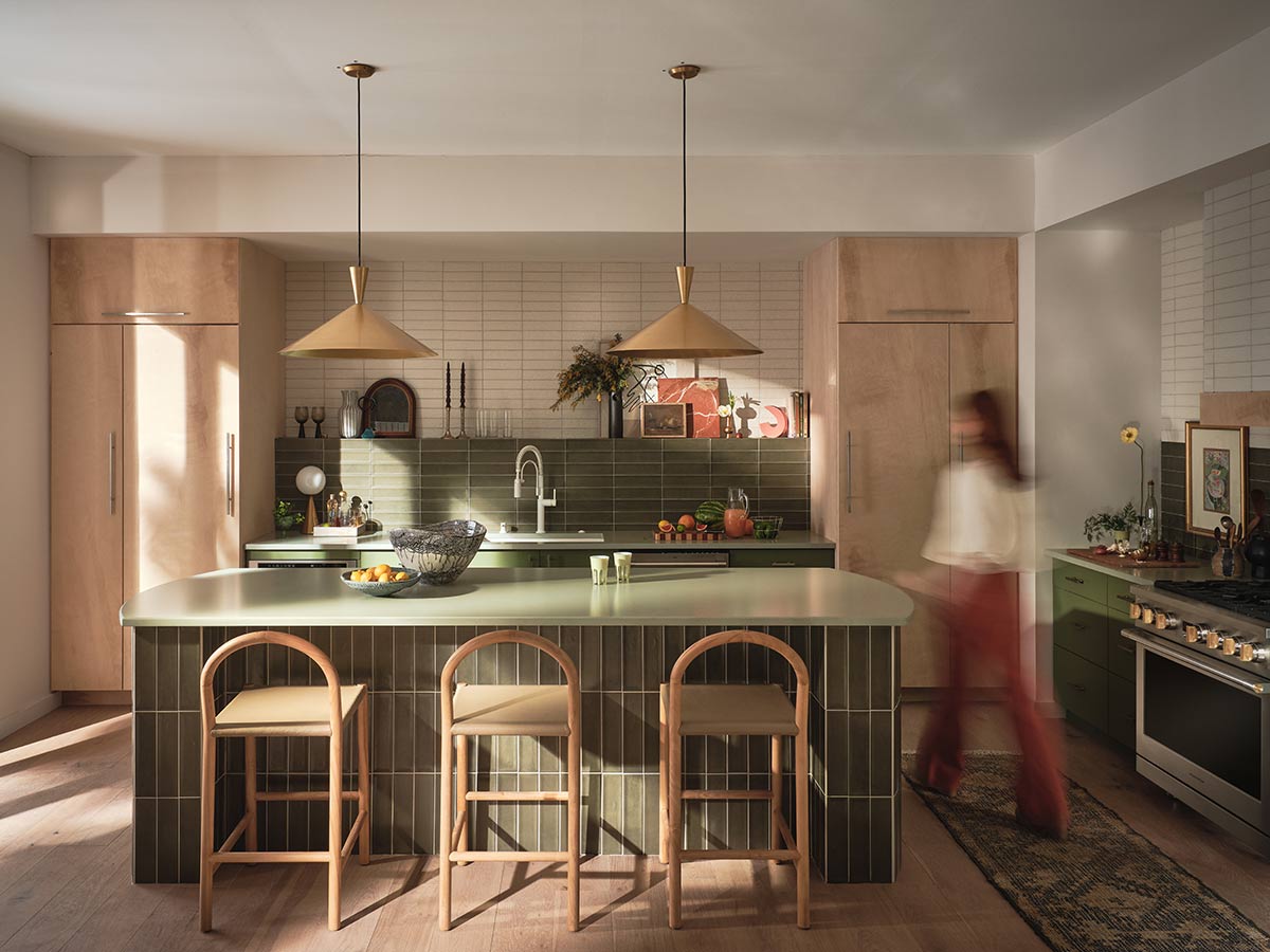 woman walking in kitchen