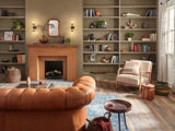 brown and white chair in beige living rom with shelves and fireplace