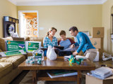 Family on Couch Preparing to Move Out