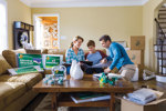 Family on Couch Preparing to Move Out