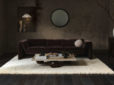 living room with brown velvet sofa with white pillow