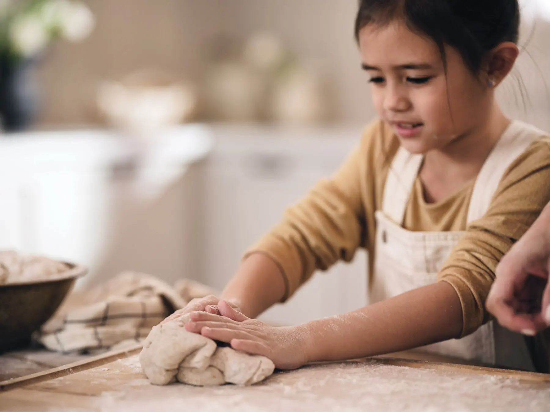 girl kneading dough