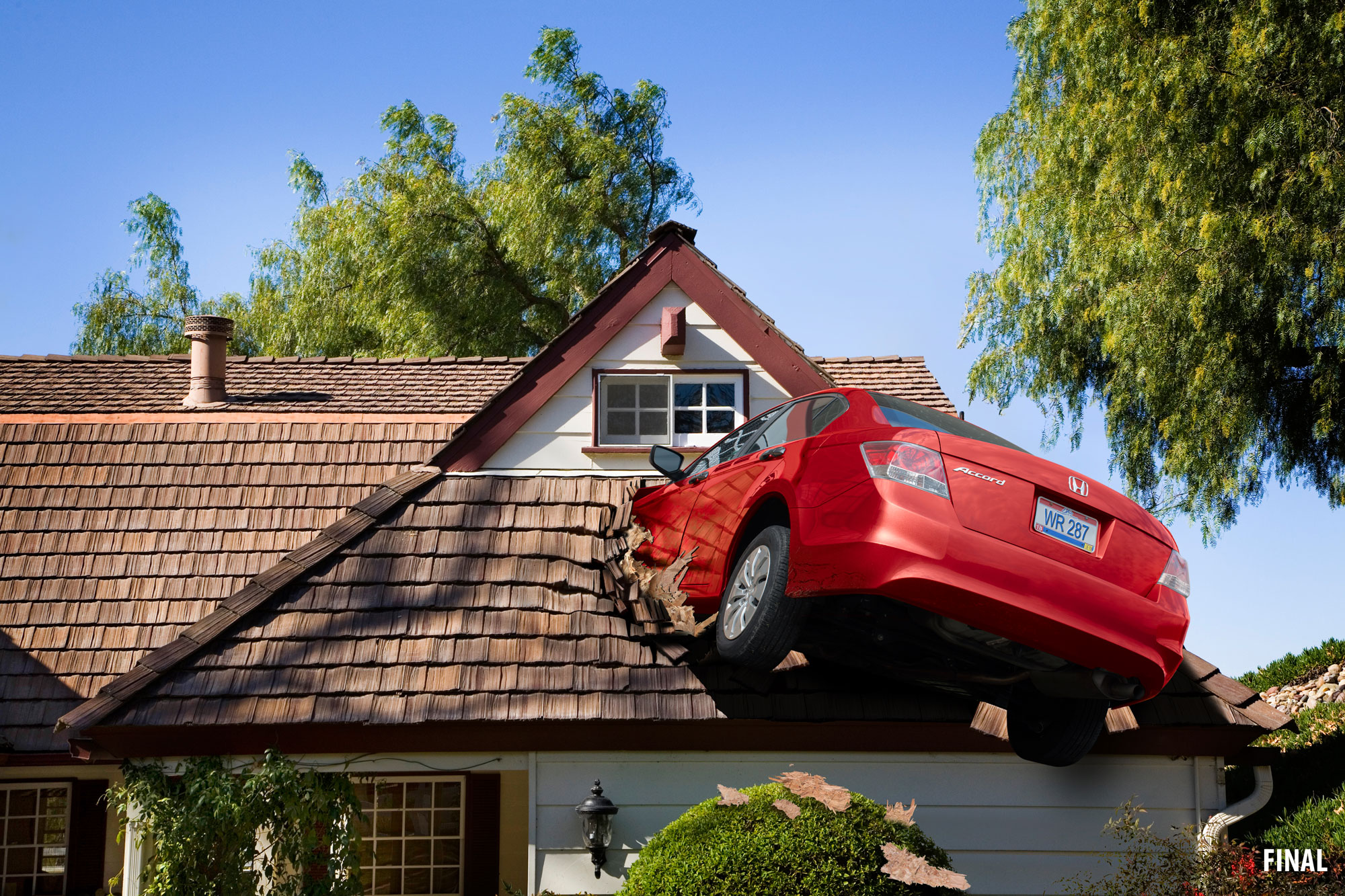 Red Honda crashed into roof