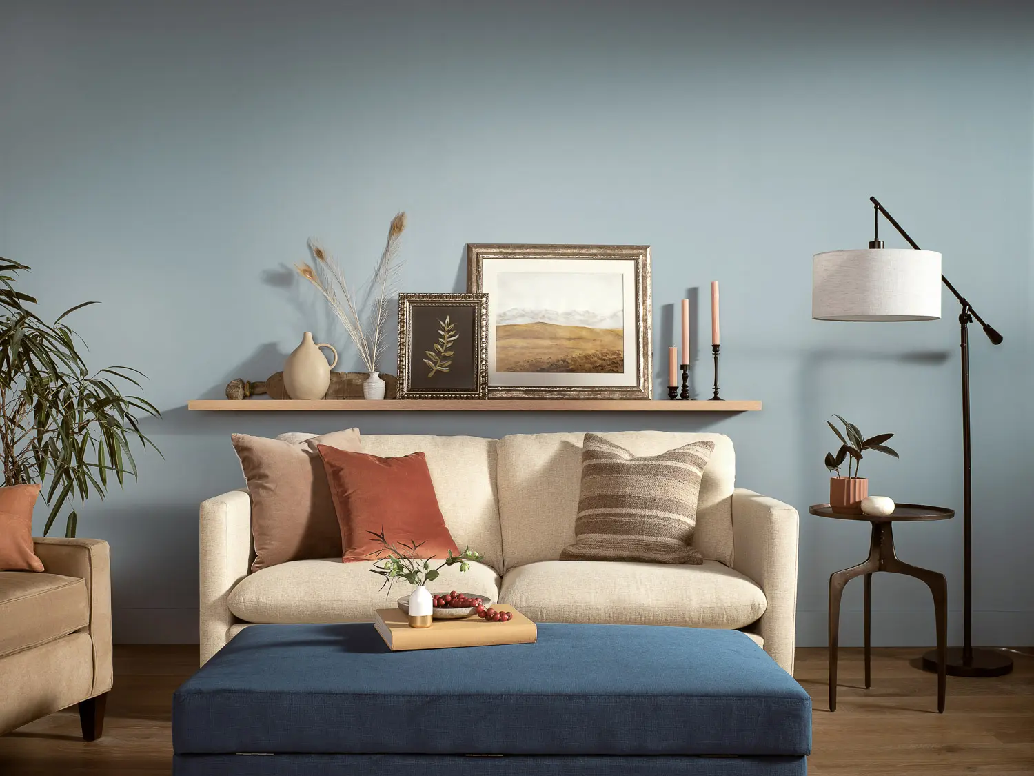 living room with sofa and ottoman